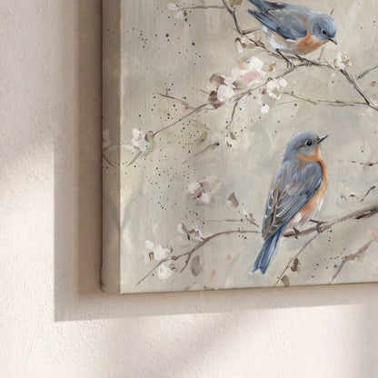 Bluebirds perched on delicate white flowering branches against pale sage 3 piece canvas wall art material and edge close up