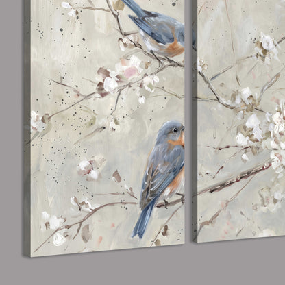 Bluebirds perched on delicate white flowering branches against pale sage 3 piece canvas wall art room and product view