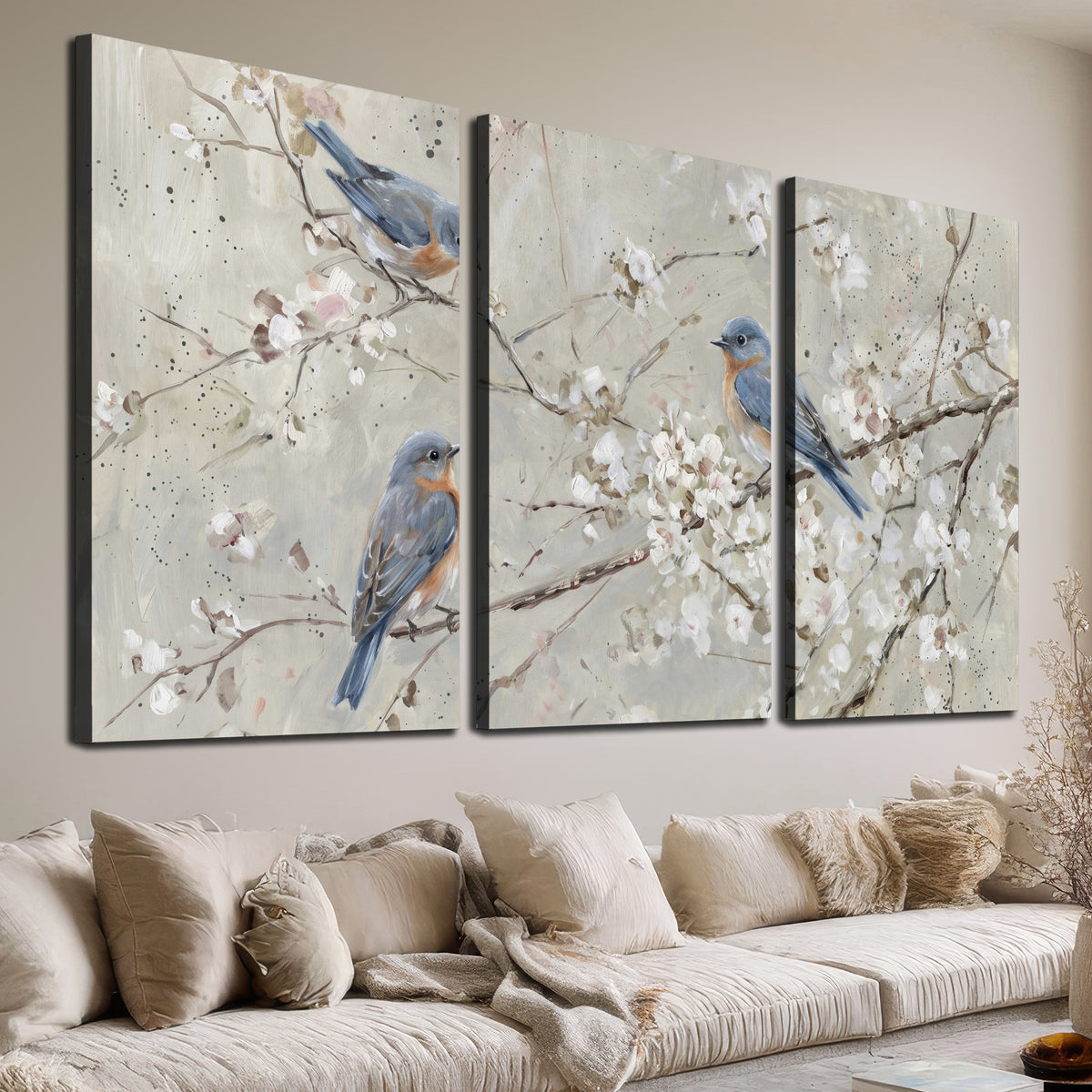 Bluebirds perched on delicate white flowering branches against pale sage 3 piece canvas wall art room and product view