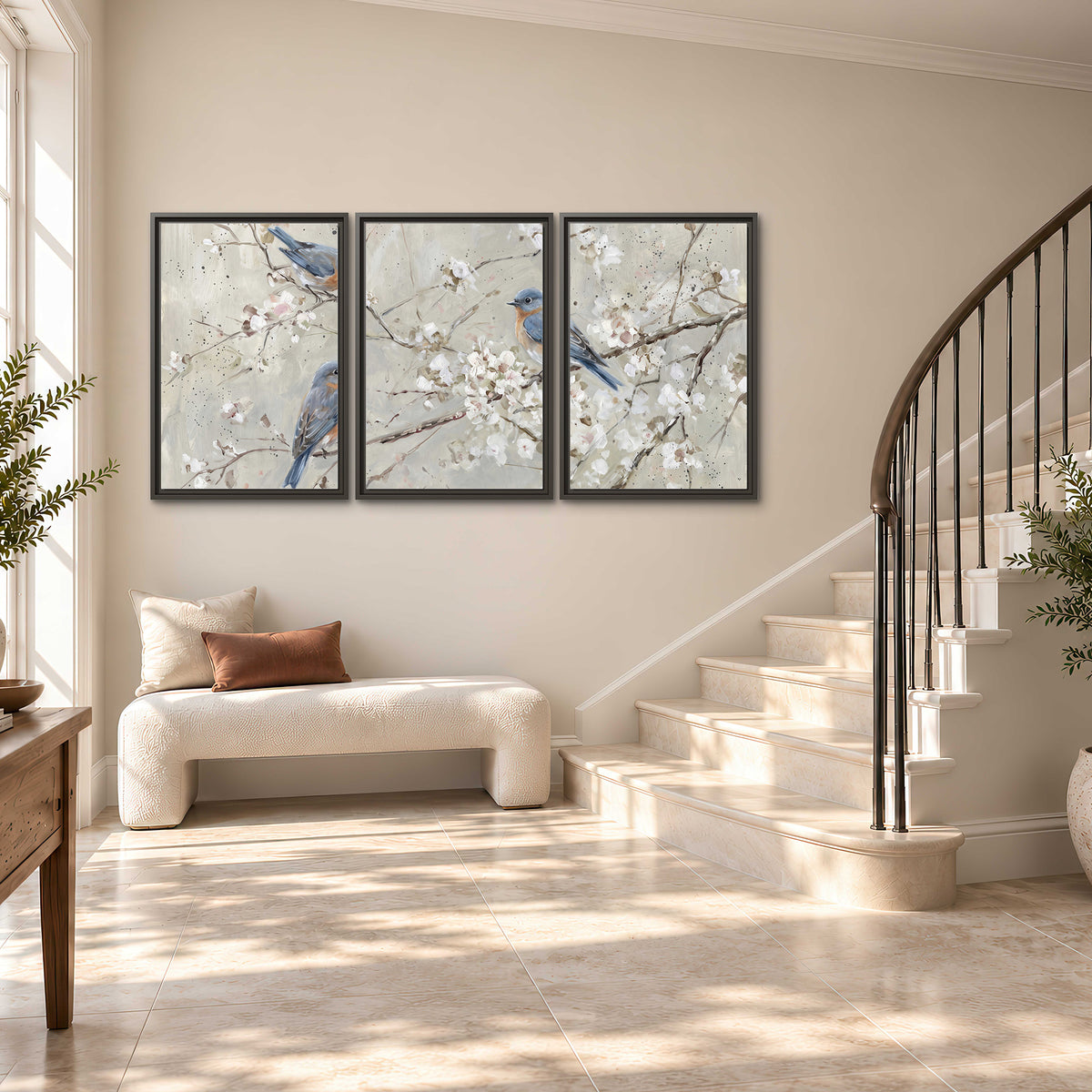 Bluebirds perched on delicate white flowering branches against pale sage 3 piece framed canvas wall art styled in an interior