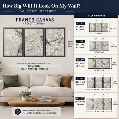 Bluebirds perched on delicate white flowering branches against pale sage 3 piece framed canvas wall art size guide above a sofa; room view is illustrative