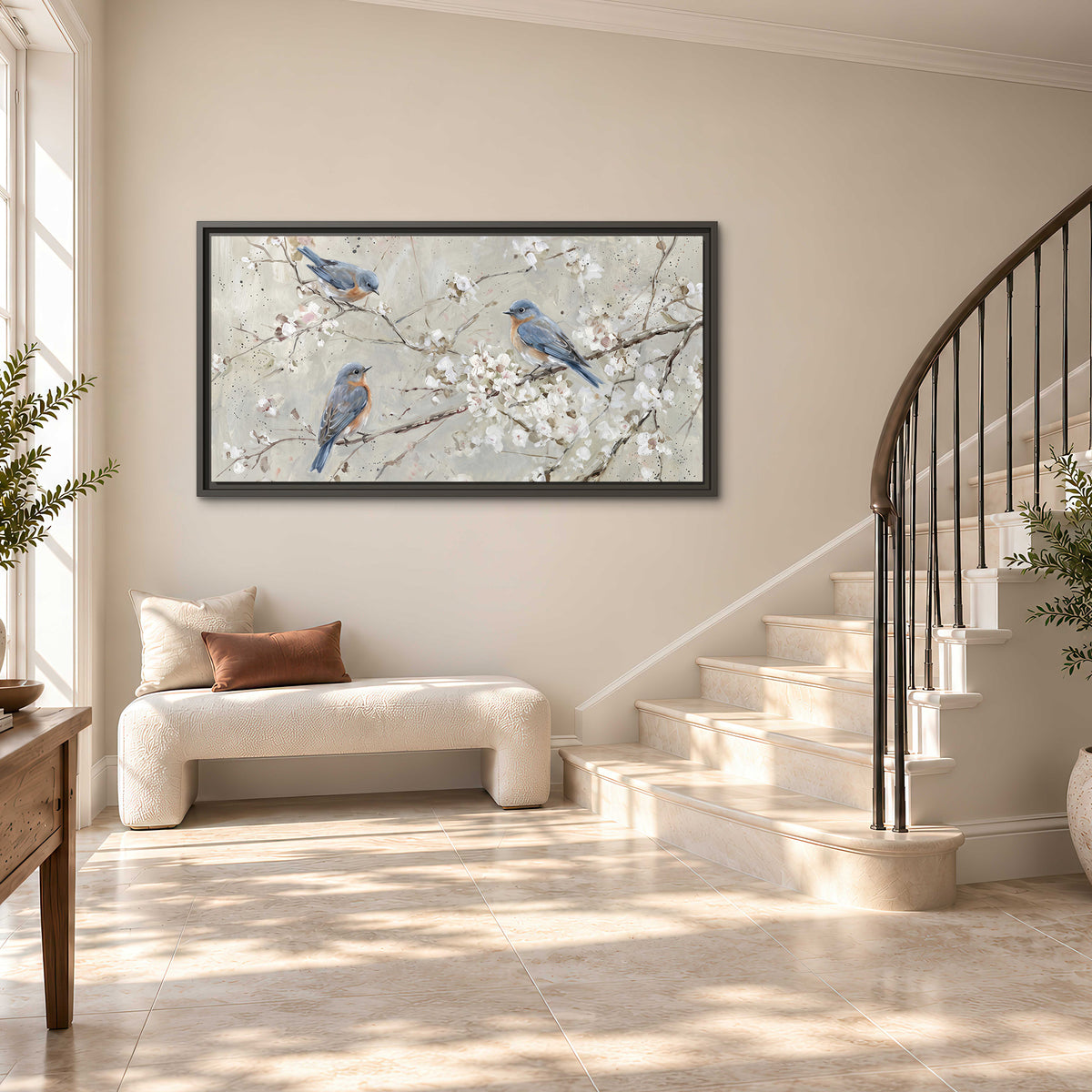 Bluebirds perched on delicate white flowering branches against pale sage single framed canvas wall art styled in an interior