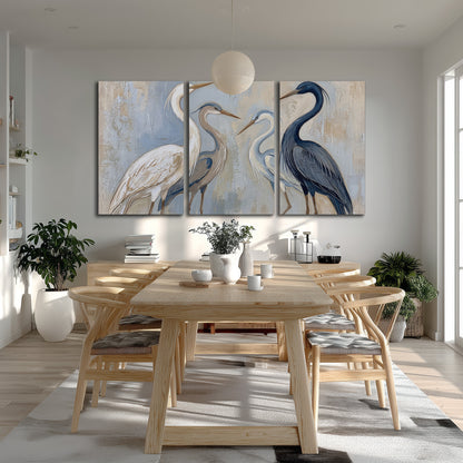 Three long-necked herons in soft ivory and dark blue against pale blue-gray 3 piece canvas wall art room and product view