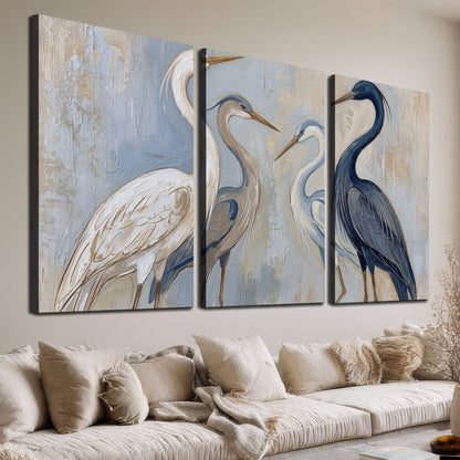 Three long-necked herons in soft ivory and dark blue against pale blue-gray 3 piece canvas wall art room and product view