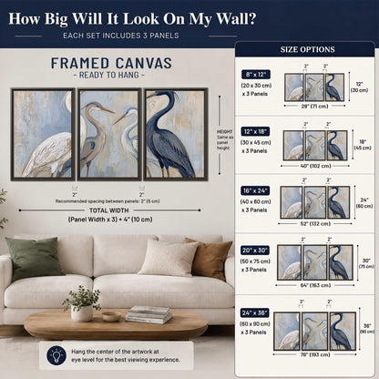 Three long-necked herons in soft ivory and dark blue against pale blue-gray 3 piece framed canvas wall art size guide above a sofa; room view is illustrative