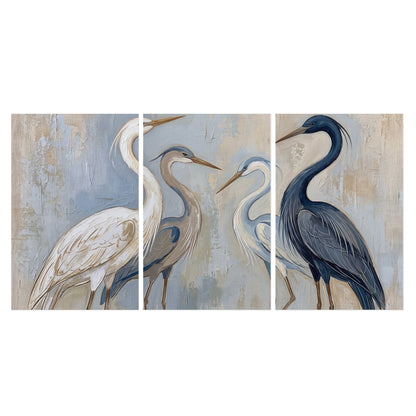 Three long-necked herons in soft ivory and dark blue against pale blue-gray set of 3 poster prints viewed straight on