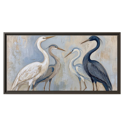 Three long-necked herons in soft ivory and dark blue against pale blue-gray single framed canvas wall art viewed straight on