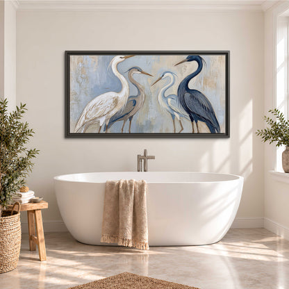 Three long-necked herons in soft ivory and dark blue against pale blue-gray single framed canvas wall art styled in an interior
