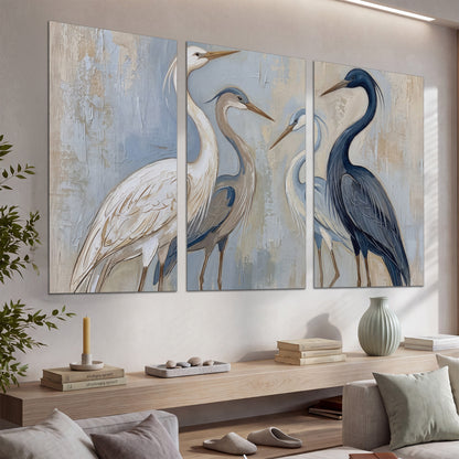 Three long-necked herons in soft ivory and dark blue against pale blue-gray set of 3 poster prints displayed in a console
