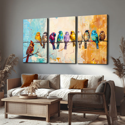 A row of brightly colored birds against expressive turquoise and ochre 3 piece canvas wall art displayed in a rustic living room