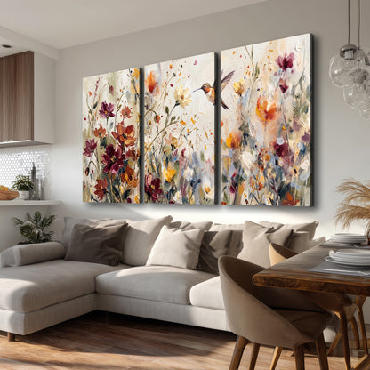 A small hummingbird among delicate pink, rust and ivory flowers 3 piece canvas wall art room and product view
