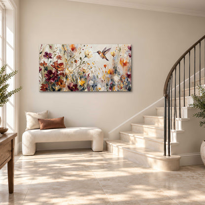 A small hummingbird among delicate pink, rust and ivory flowers single canvas wall art styled in an interior