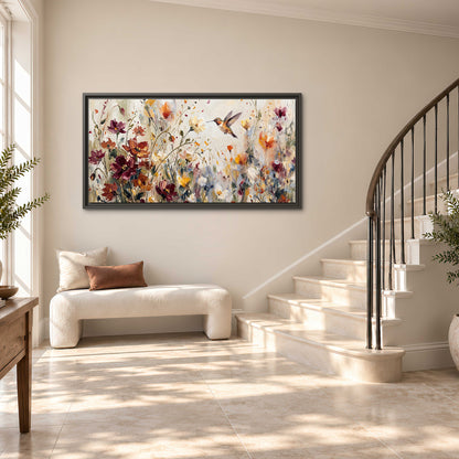 A small hummingbird among delicate pink, rust and ivory flowers single framed canvas wall art styled in an interior