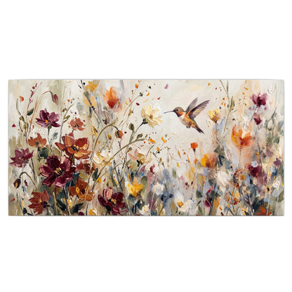 A small hummingbird among delicate pink, rust and ivory flowers single canvas wall art viewed straight on