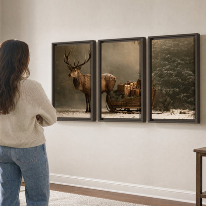 A stag beside a rustic gift-filled sleigh in a misty evergreen woodland 3 piece framed canvas wall art three panel arrangement on a wall