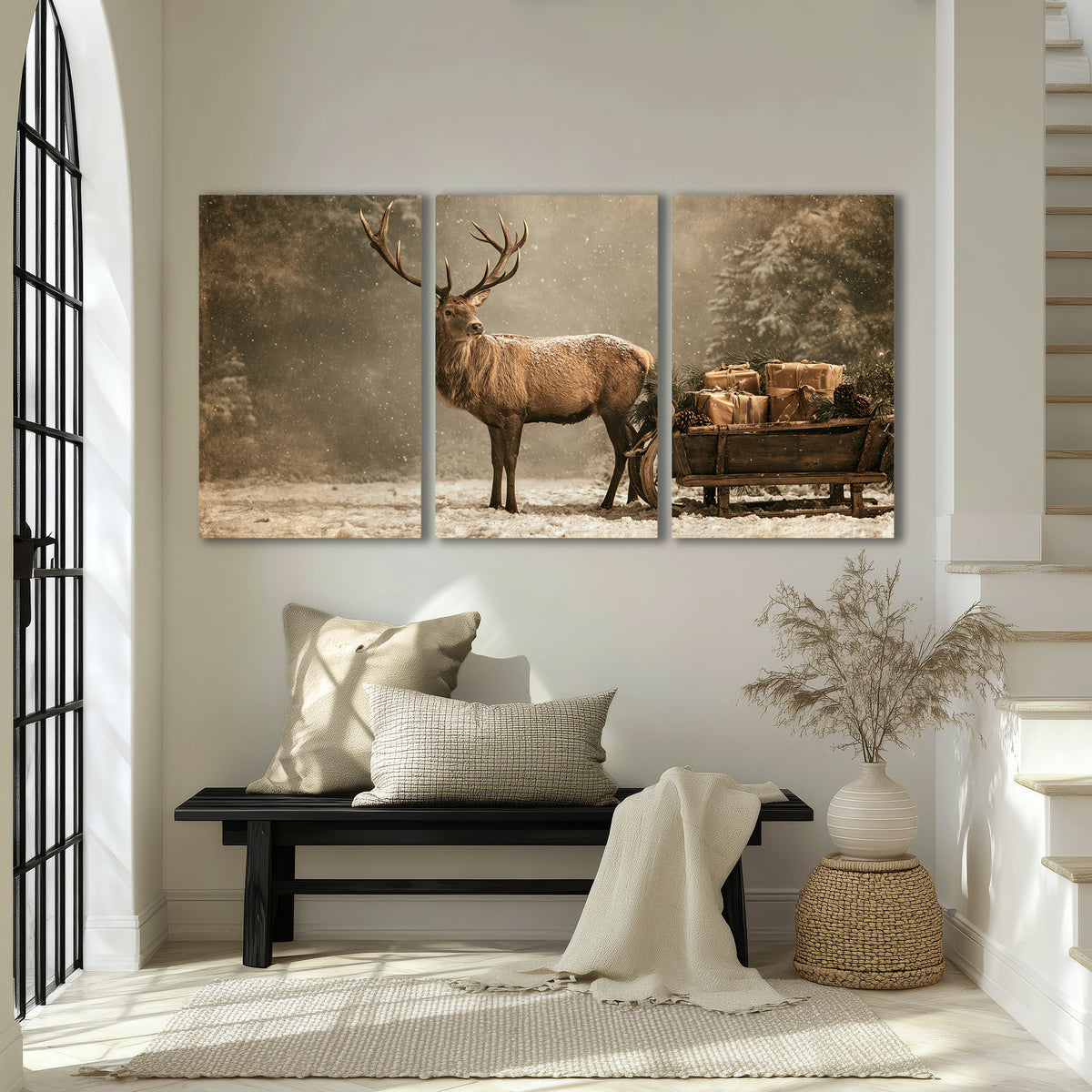 A majestic stag beside a wooden sleigh filled with wrapped gifts in a softly lit woodland 3 piece canvas wall art displayed in a entryway