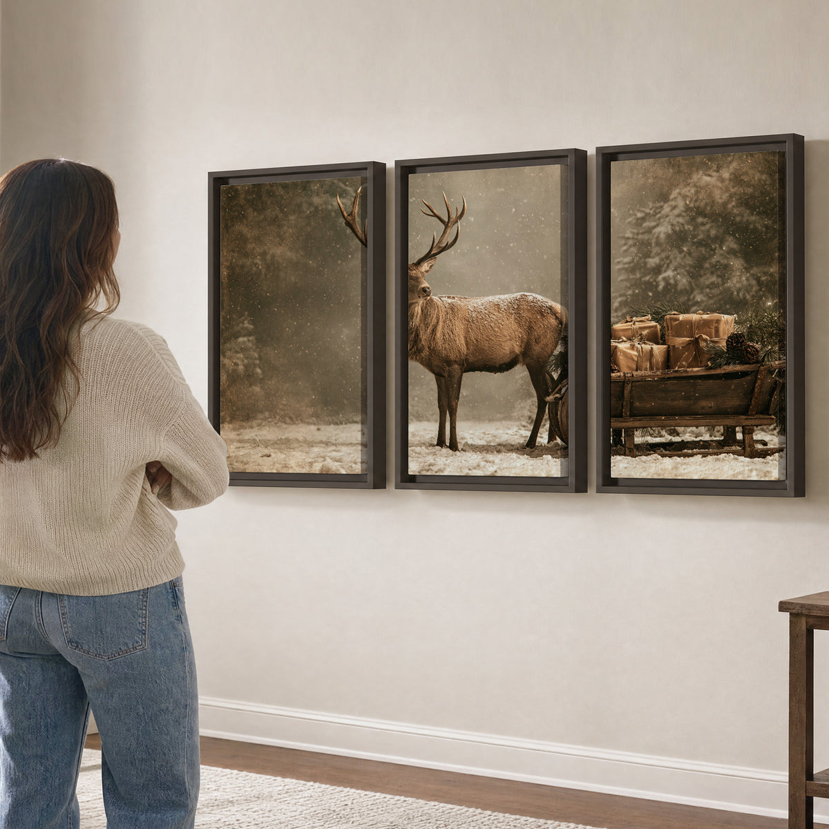 A majestic stag beside a wooden sleigh filled with wrapped gifts in a softly lit woodland 3 piece framed canvas wall art three panel arrangement on a wall
