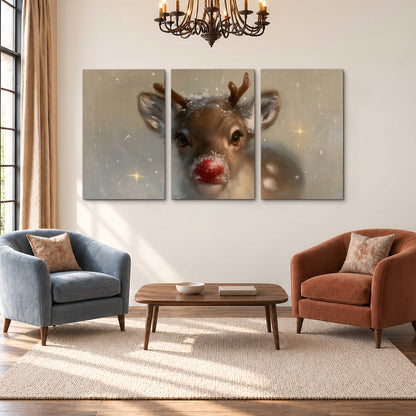 A young reindeer with a bright red nose surrounded by soft snowflakes and tiny painted stars 3 piece canvas wall art styled in an interior