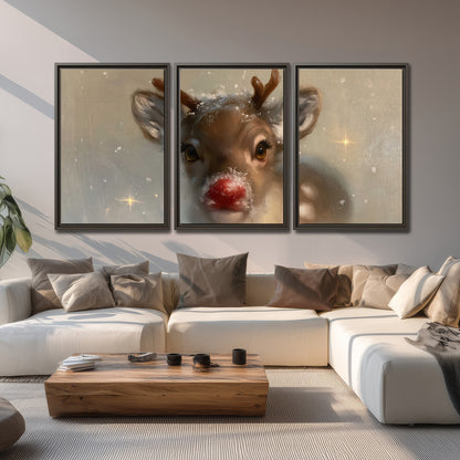 A young reindeer with a bright red nose surrounded by soft snowflakes and tiny painted stars 3 piece framed canvas wall art displayed in a living room