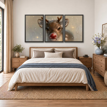 A young reindeer with a bright red nose surrounded by soft snowflakes and tiny painted stars 3 piece framed canvas wall art styled in an interior