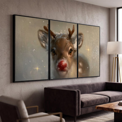 A young reindeer with a bright red nose surrounded by soft snowflakes and tiny painted stars 3 piece framed canvas wall art displayed in a modern living room