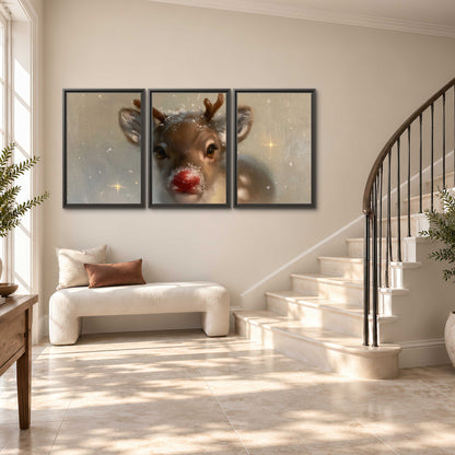 A young reindeer with a bright red nose surrounded by soft snowflakes and tiny painted stars 3 piece framed canvas wall art styled in an interior