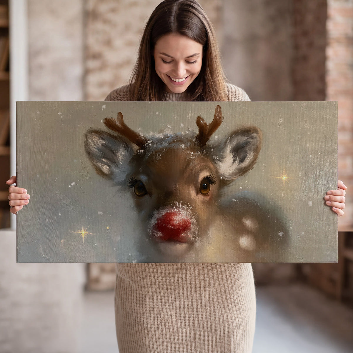A young reindeer with a bright red nose surrounded by soft snowflakes and tiny painted stars single canvas wall art held in hands
