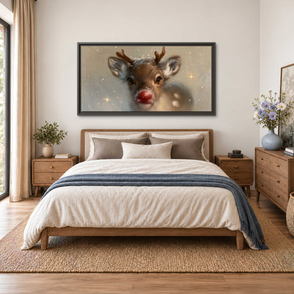 A young reindeer with a bright red nose surrounded by soft snowflakes and tiny painted stars single framed canvas wall art styled in an interior