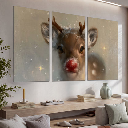 A young reindeer with a bright red nose surrounded by soft snowflakes and tiny painted stars set of 3 poster prints displayed in a console
