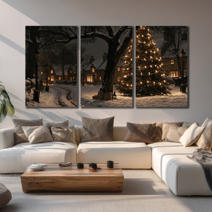 A tall illuminated Christmas tree beneath dark branches beside warmly lit snowy cottages 3 piece canvas wall art displayed in a living room