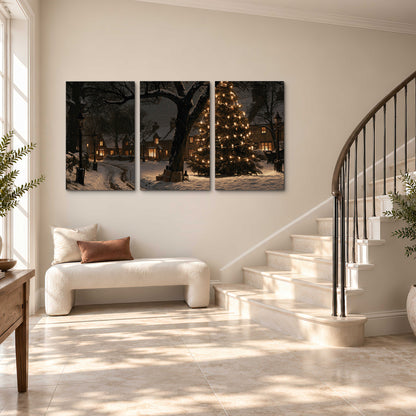 A tall illuminated Christmas tree beneath dark branches beside warmly lit snowy cottages 3 piece canvas wall art styled in an interior