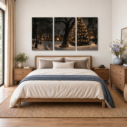 A tall illuminated Christmas tree beneath dark branches beside warmly lit snowy cottages 3 piece canvas wall art styled in an interior