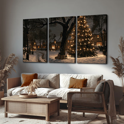 A tall illuminated Christmas tree beneath dark branches beside warmly lit snowy cottages 3 piece canvas wall art displayed in a rustic living room