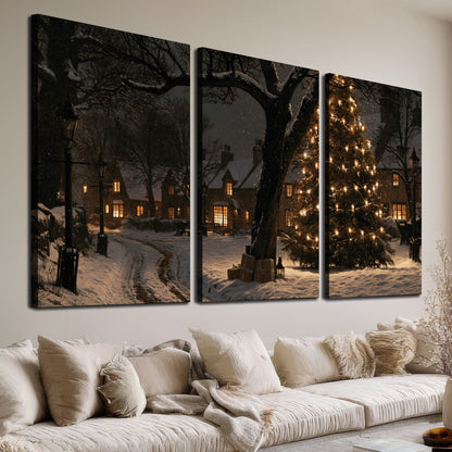 A tall illuminated Christmas tree beneath dark branches beside warmly lit snowy cottages 3 piece canvas wall art room and product view