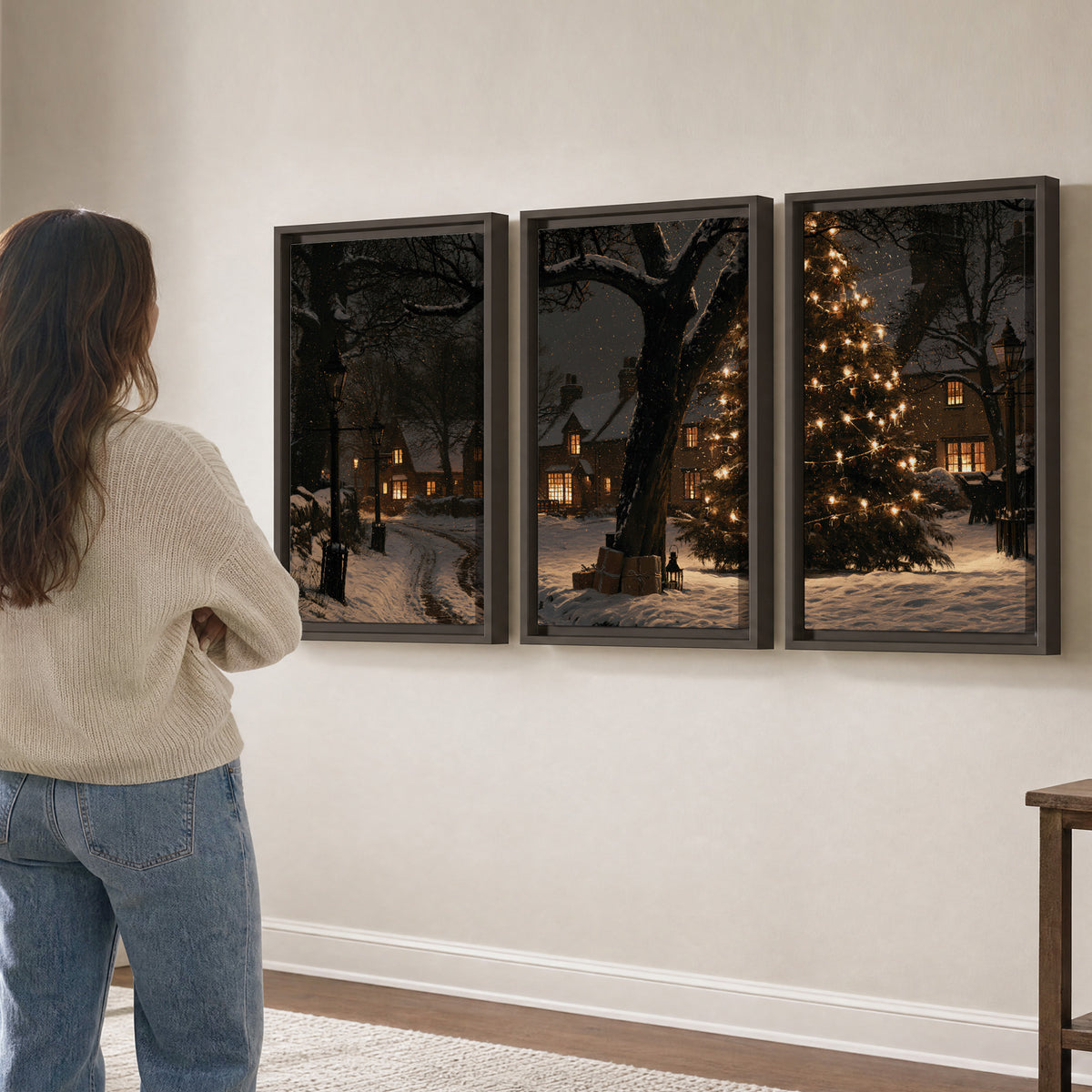 A tall illuminated Christmas tree beneath dark branches beside warmly lit snowy cottages 3 piece framed canvas wall art three panel arrangement on a wall