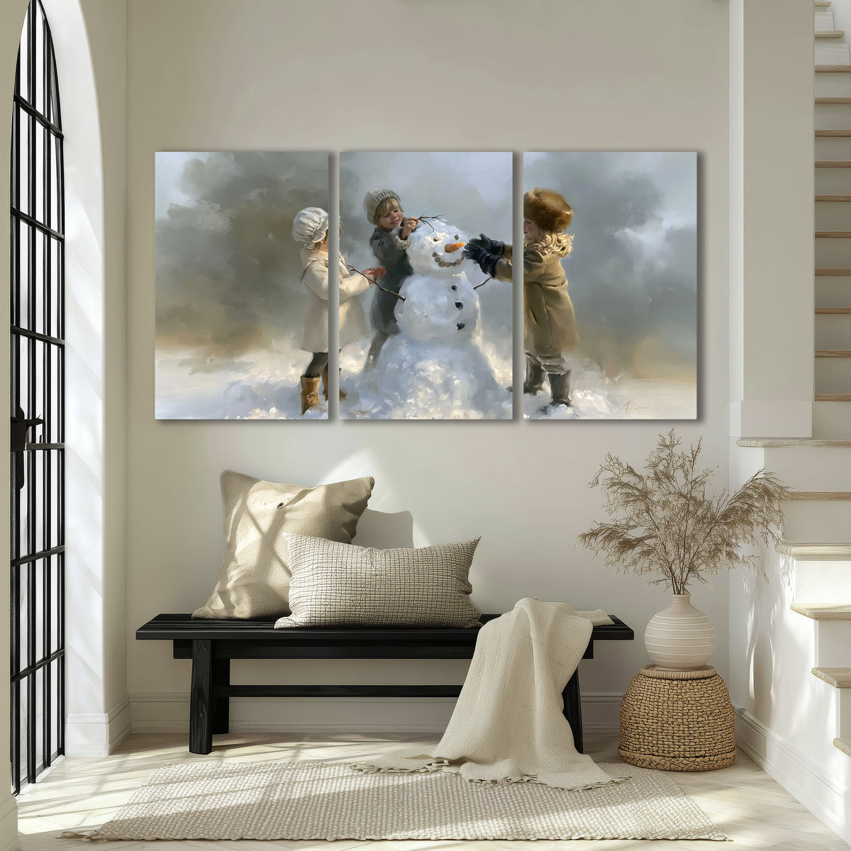 Three children gathering around a cheerful snowman on a quiet snowy winter day 3 piece canvas wall art displayed in a entryway