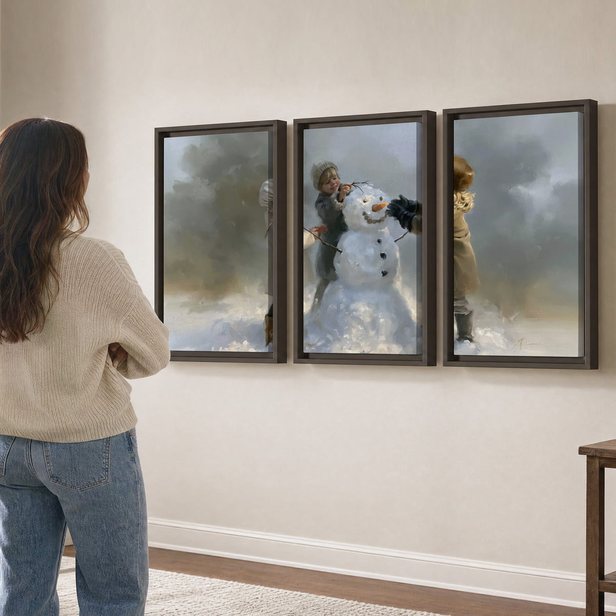 Three children gathering around a cheerful snowman on a quiet snowy winter day 3 piece framed canvas wall art three panel arrangement on a wall