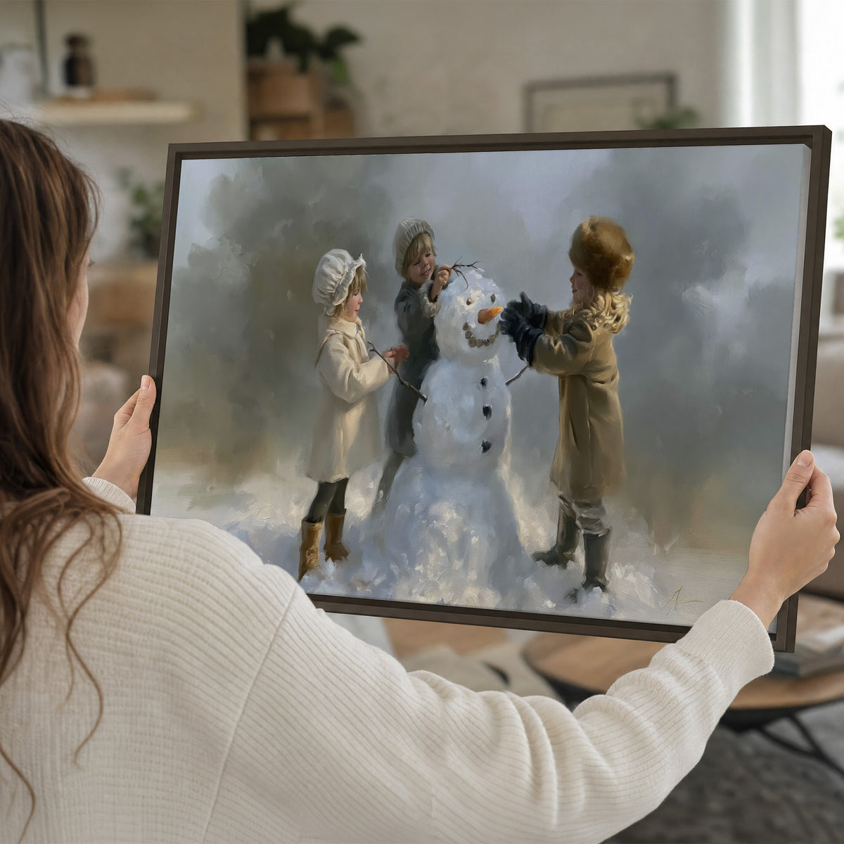 Three children gathering around a cheerful snowman on a quiet snowy winter day single framed canvas wall art held in hands