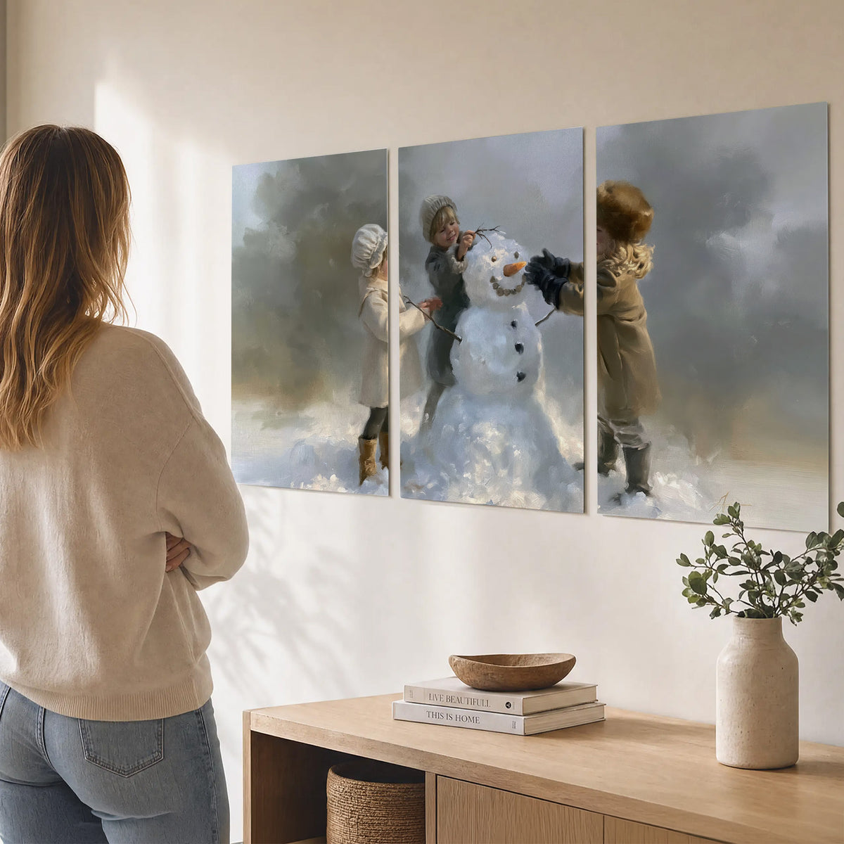 Three children gathering around a cheerful snowman on a quiet snowy winter day set of 3 poster prints three panel arrangement on a wall