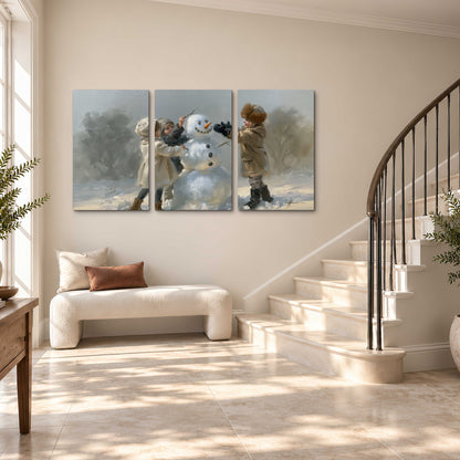 Two children putting the finishing touches on a snowman in a soft snowy landscape 3 piece canvas wall art styled in an interior