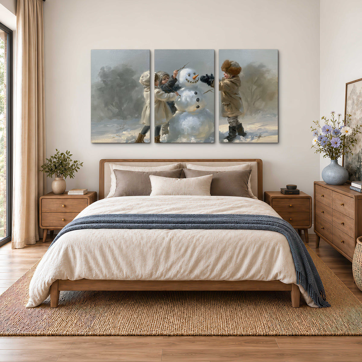 Two children putting the finishing touches on a snowman in a soft snowy landscape 3 piece canvas wall art styled in an interior