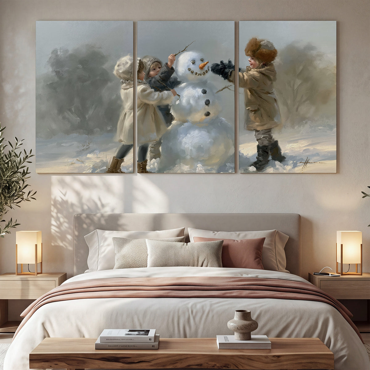 Two children putting the finishing touches on a snowman in a soft snowy landscape 3 piece canvas wall art displayed in a bedroom