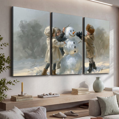 Two children putting the finishing touches on a snowman in a soft snowy landscape 3 piece canvas wall art displayed in a console