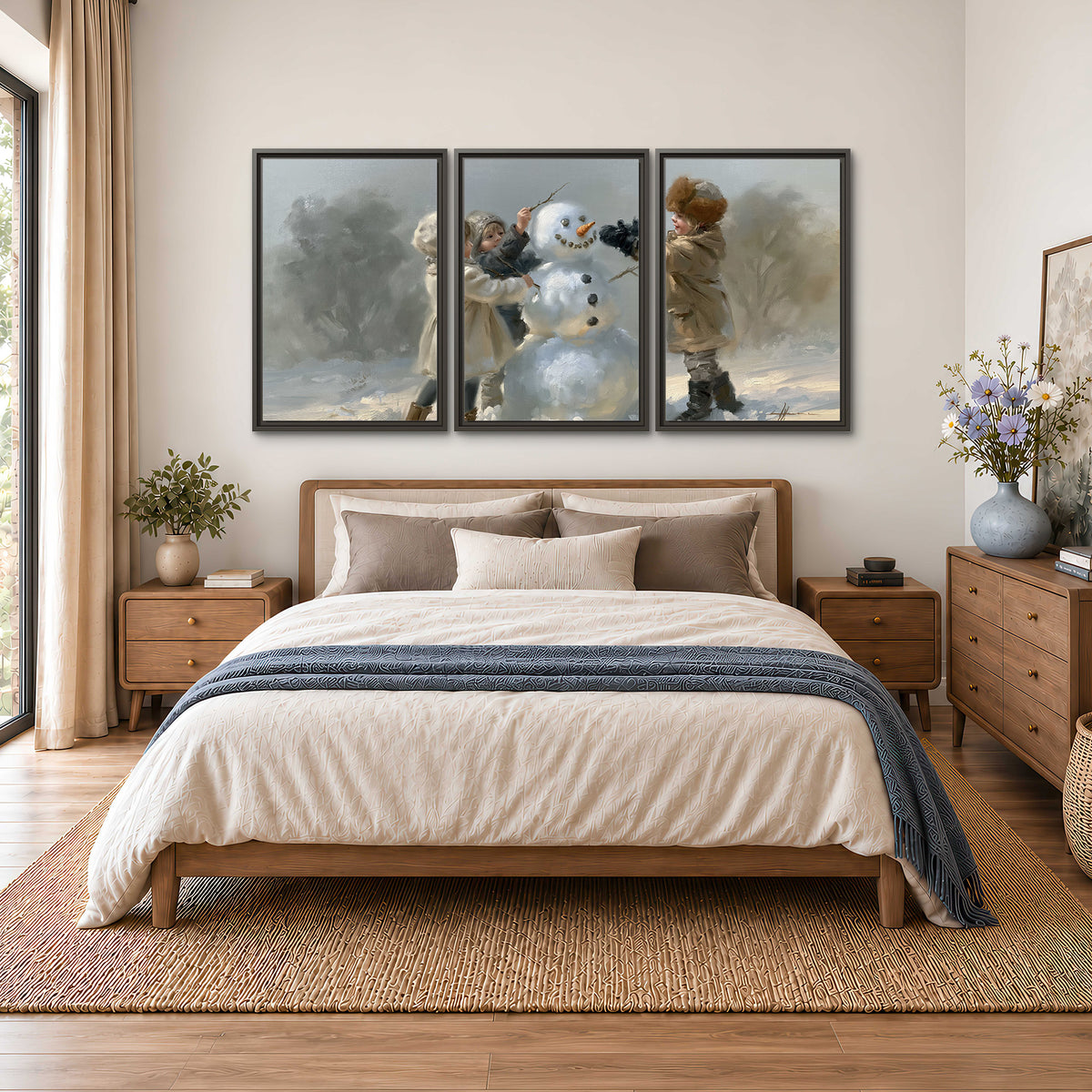 Two children putting the finishing touches on a snowman in a soft snowy landscape 3 piece framed canvas wall art styled in an interior