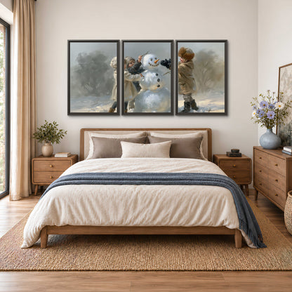 Two children putting the finishing touches on a snowman in a soft snowy landscape 3 piece framed canvas wall art styled in an interior