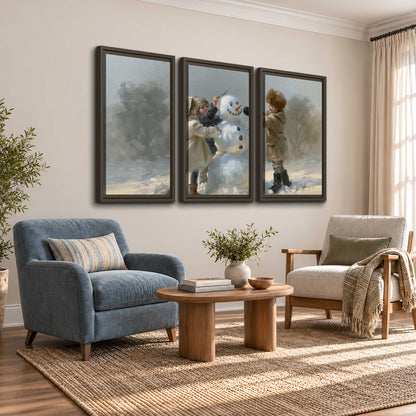 Two children putting the finishing touches on a snowman in a soft snowy landscape 3 piece framed canvas wall art styled in an interior