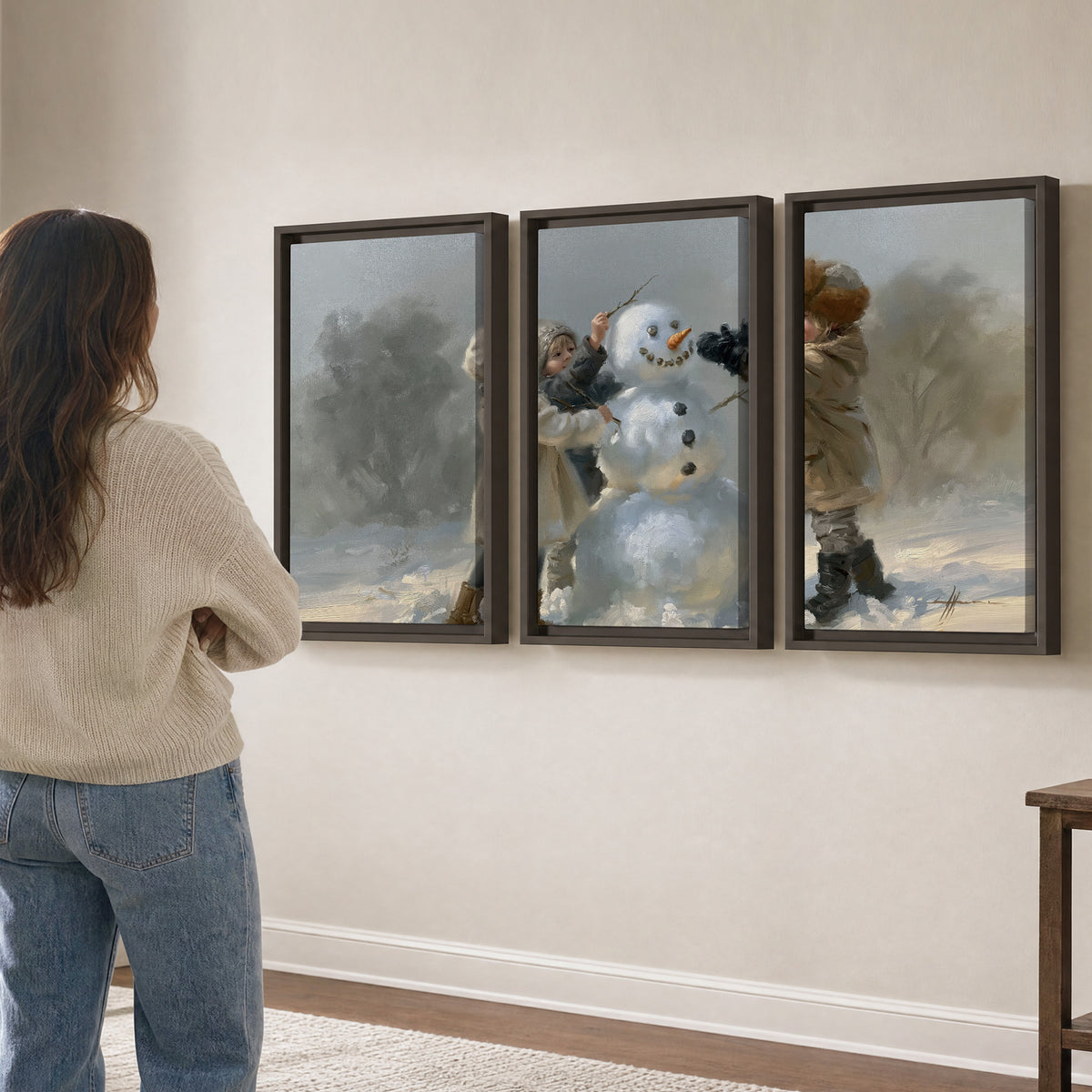 Two children putting the finishing touches on a snowman in a soft snowy landscape 3 piece framed canvas wall art three panel arrangement on a wall