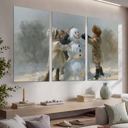 Two children putting the finishing touches on a snowman in a soft snowy landscape set of 3 poster prints displayed in a console
