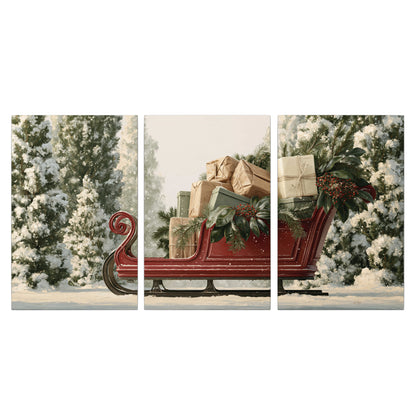 A red sleigh filled with wrapped gifts and evergreen branches among snowy fir trees 3 piece canvas wall art viewed straight on