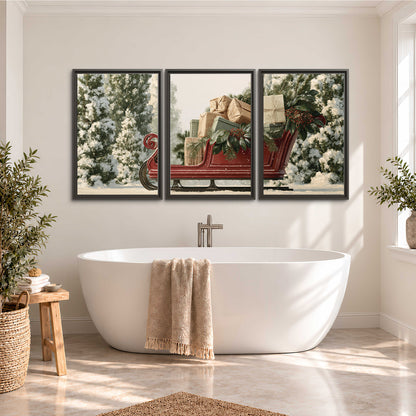 A red sleigh filled with wrapped gifts and evergreen branches among snowy fir trees 3 piece framed canvas wall art styled in an interior